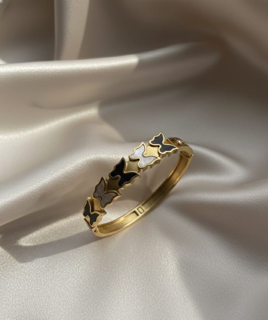 Butterfly gold plated bangel.