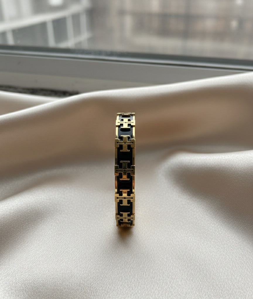 Tory black and gold bangle