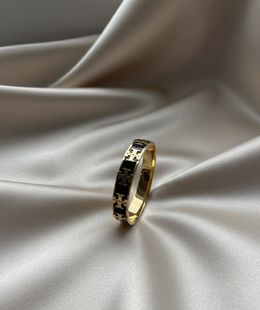 Tory black and gold bangle