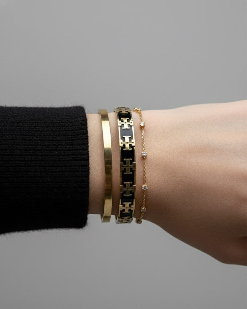 Tory black and gold bangle