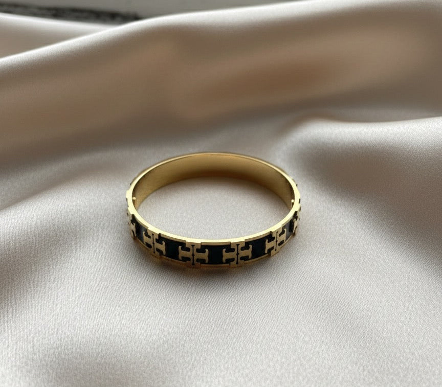 Tory black and gold bangle