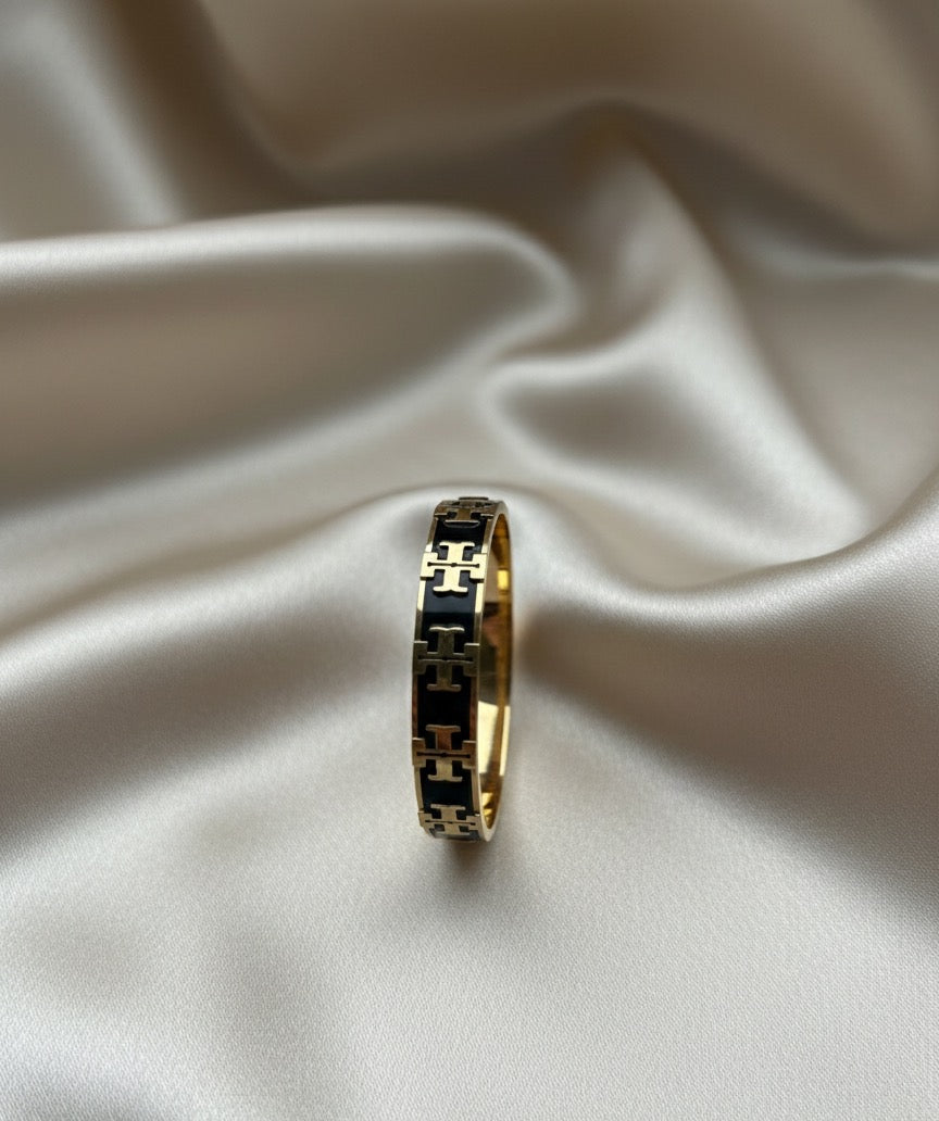 Tory black and gold bangle