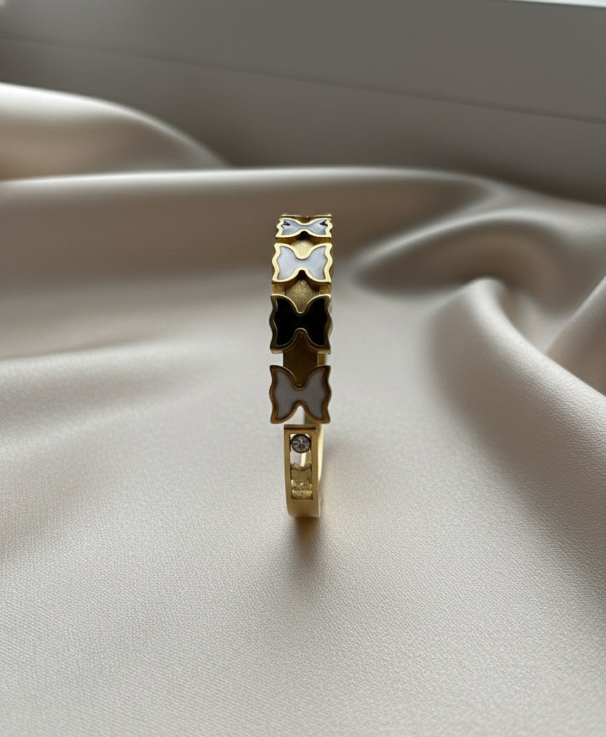 Butterfly gold plated bangel.